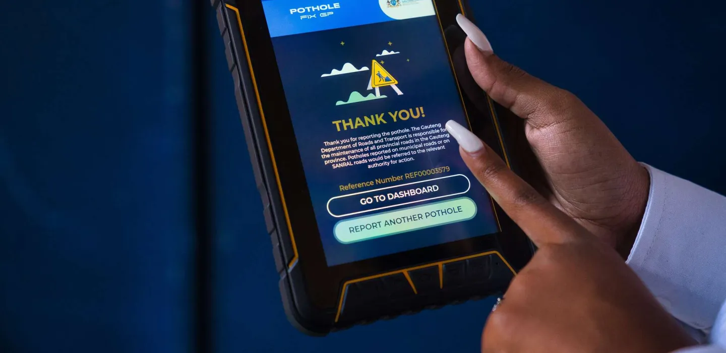 Fingers pointing at tablet screen